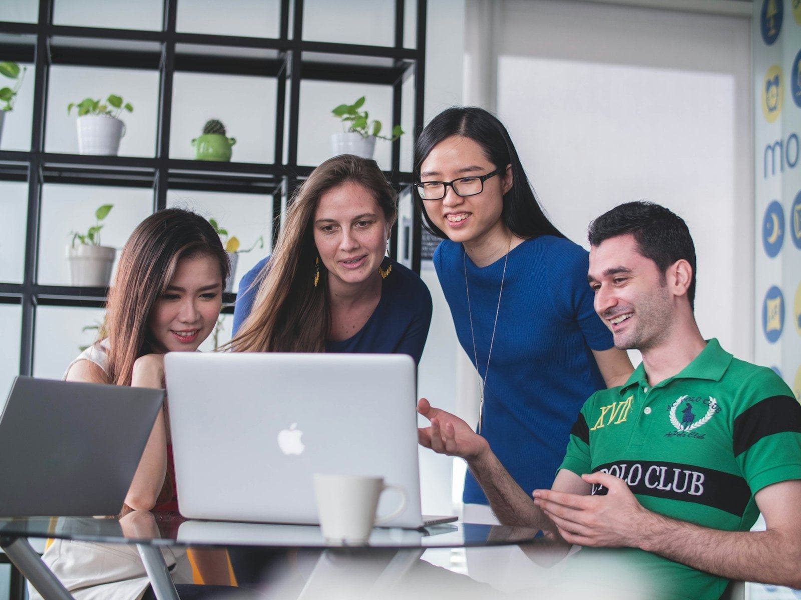 Young professionals smiling as they work together
