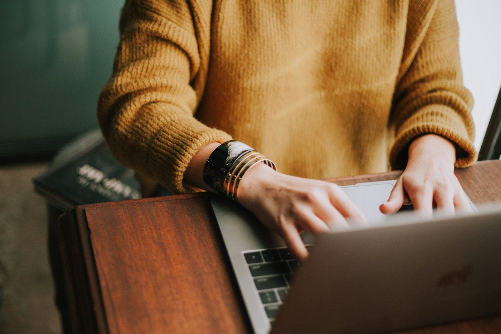 A professional working steadily at a laptop